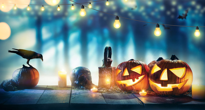 Spooky halloween pumpkins on wooden planks