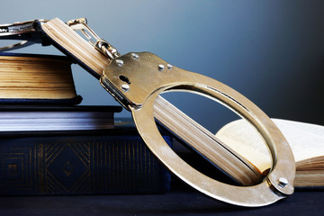 Obraz premium Legal system and Justice concept. Handcuffs and open book.