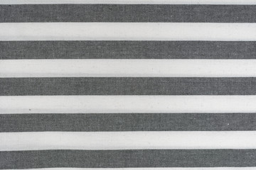 Fototapeta premium A black and white striped cloth for kitchen towels
