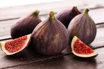 Fresh figs. Food Photo. whole and sliced figs on rustic background.