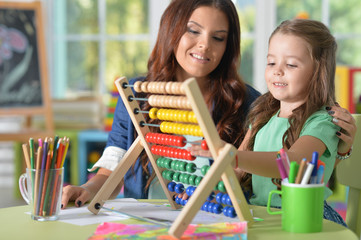Portrait of a girl doing math exercises