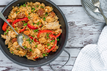 Spanish paella with prawns, chicken, chorizo and red pepper - top view