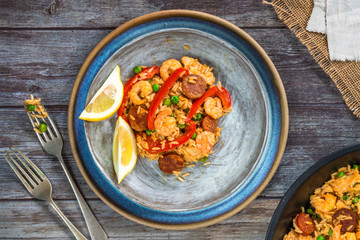Spanish paella with prawns, chicken, chorizo and red pepper - top view