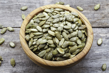 pumpkin seeds on a wooden background