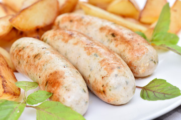 Bavarian sausages. German cuisine. A dish of chicken meat.