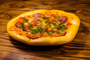 Fresh homemade pizza on a wooden table