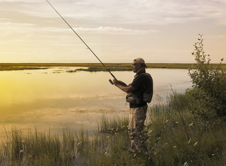 Men fishes on the river