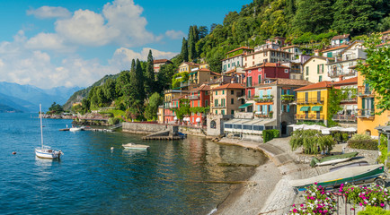 Fototapeta na wymiar Beautiful Varenna waterfront on a sunny summer afternoon, Lake Como, Lombardy, Italy.