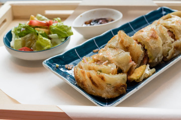 Traditional Taiwanese fried pancake with bacon and cheese filling
