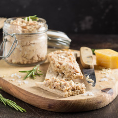 Tuna pate with egg, cheese in jar and crispy bread. Fish rillette, healthy snack, diet food