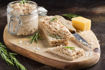 Tuna pate with egg, cheese in jar and crispy bread. Fish rillette, healthy snack, diet food