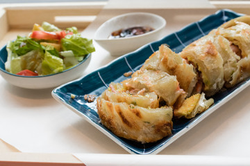 Traditional Taiwanese fried pancake with bacon and cheese filling