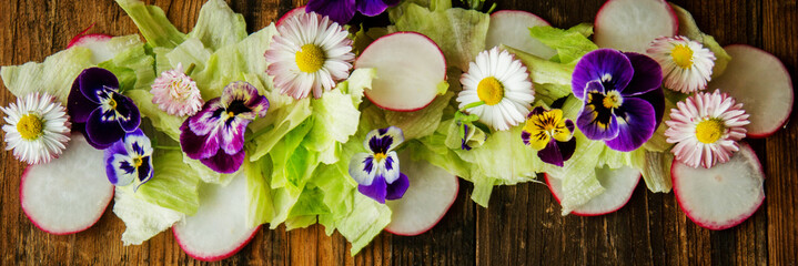 Healthy food. Detox. Organic nutrition. Salad leaves with herbs and flowers
