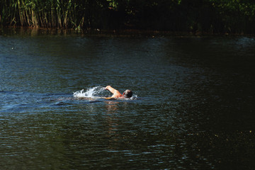 a man swimming with a breaststroke in the water