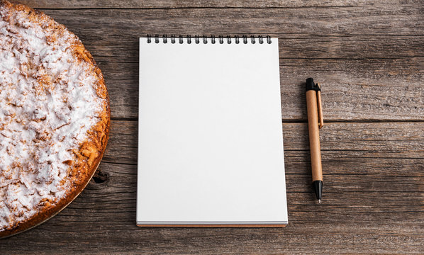 Homemade cake. There is a notepad to accommodate your recipe.