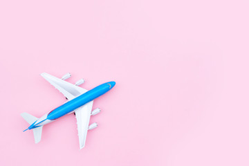 Plane model on pink background with copy space