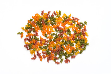 Multicolored Italian pasta from different varieties of flour on a white background