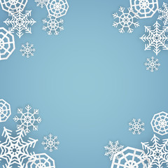 Vector paper cut style white snowflakes on blue background with space for your text