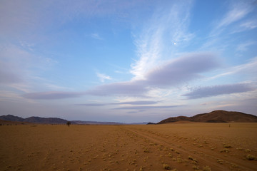 Fototapeta na wymiar Barren arid desert after sunset