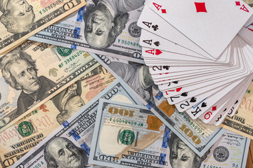 American dollars banknotes with playing cards closeup