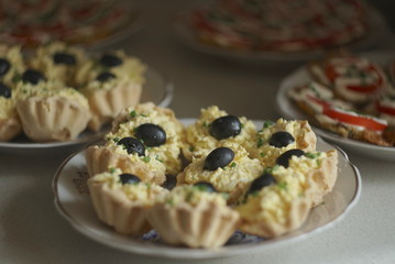 appetizer from egg cheese and olives. 