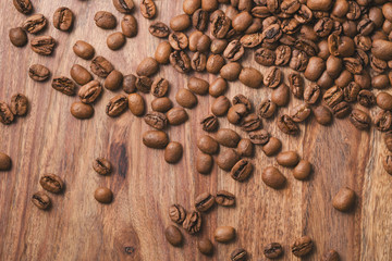 coffee beans falling on wood table