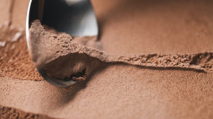 Close-up chocolate ice cream scooping background