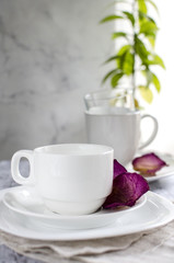 White plates, cup and glasses on the table
