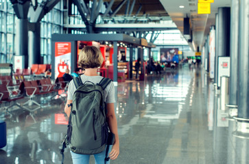 Travel concept, people in the airports , young girl with luggage walking at airport