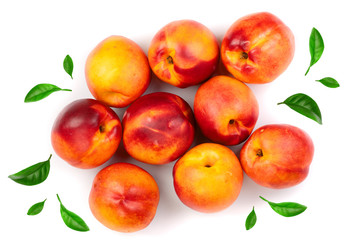 ripe nectarine with leaves isolated on white background. Top view. Flat lay pattern