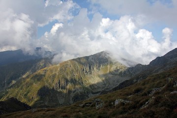 Layers of mountains surrounded by clouds
