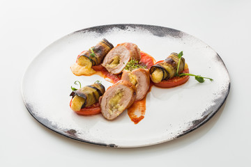 sausages with cheese in a plate isolated on white background