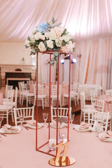 Table 11 set for wedding or another catered event dinner. Luxury decorated with natural flowers. Vertical view photo