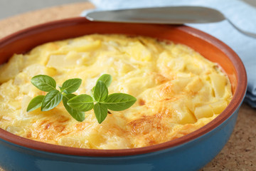 Frittata topped with basil leaf