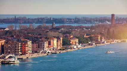 Fototapeta premium Venice panoramic aerial view with red roofs, Veneto, Italy. Aerial view with dense medieval red roofs of Venice, Italy