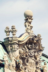 Fototapeta na wymiar Atlas god statue holding sphere on shoulders, Wallpavillon Zwinger palace, Dresden, Germany, sunny day clear blue sky background