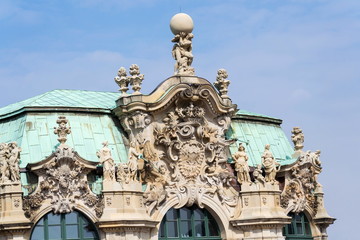 Fototapeta na wymiar Atlas god statue holding sphere on shoulders, Wallpavillon Zwinger palace, Dresden, Germany, sunny day clear blue sky background