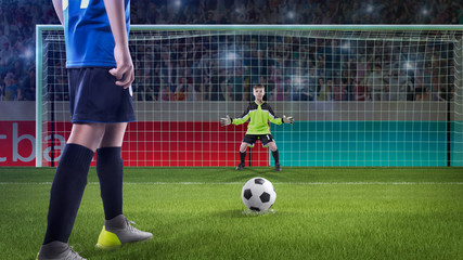 kid football player prepairing to take a shot on a football field