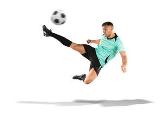 Fototapeta na wymiar soccer player kicking the ball in the air isolated on white