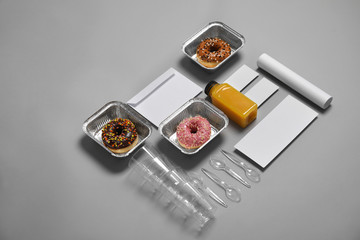Composition with items for mock up design on gray background. Food delivery service