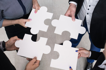 Hands holding puzzle