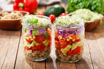 Vegetarian food. Healthy salad with quinoa and vegetables in a glass jar