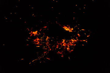 Flame of fire with sparks on a black background