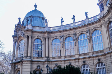 Angular tower of ancient palace with statues