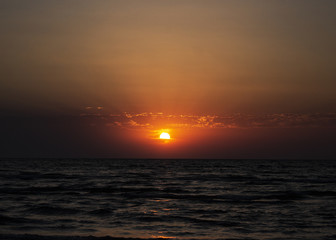 Fototapeta na wymiar Morning with dawn at the seaside