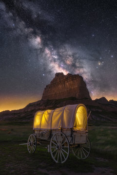Night sky over old covered wagon along the historical Oregon Trail in Nebraska
