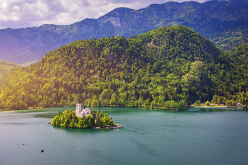 Fototapeta premium Lake Bled with St. Marys Church of Assumption on small island. Bled, Slovenia, Europe. The Church of the Assumption, Bled, Slovenia. The Lake Bled and Santa Maria Church near Bled, Slovenia.