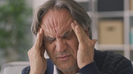 Old man suffering from headache - Powered by Adobe