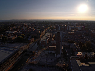 Aerial view, drone silhouette of Chester city during sunset sun close to canal, old shot tower and steam mill area