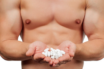 Man bodybuilder taking steroids in the form of tablets